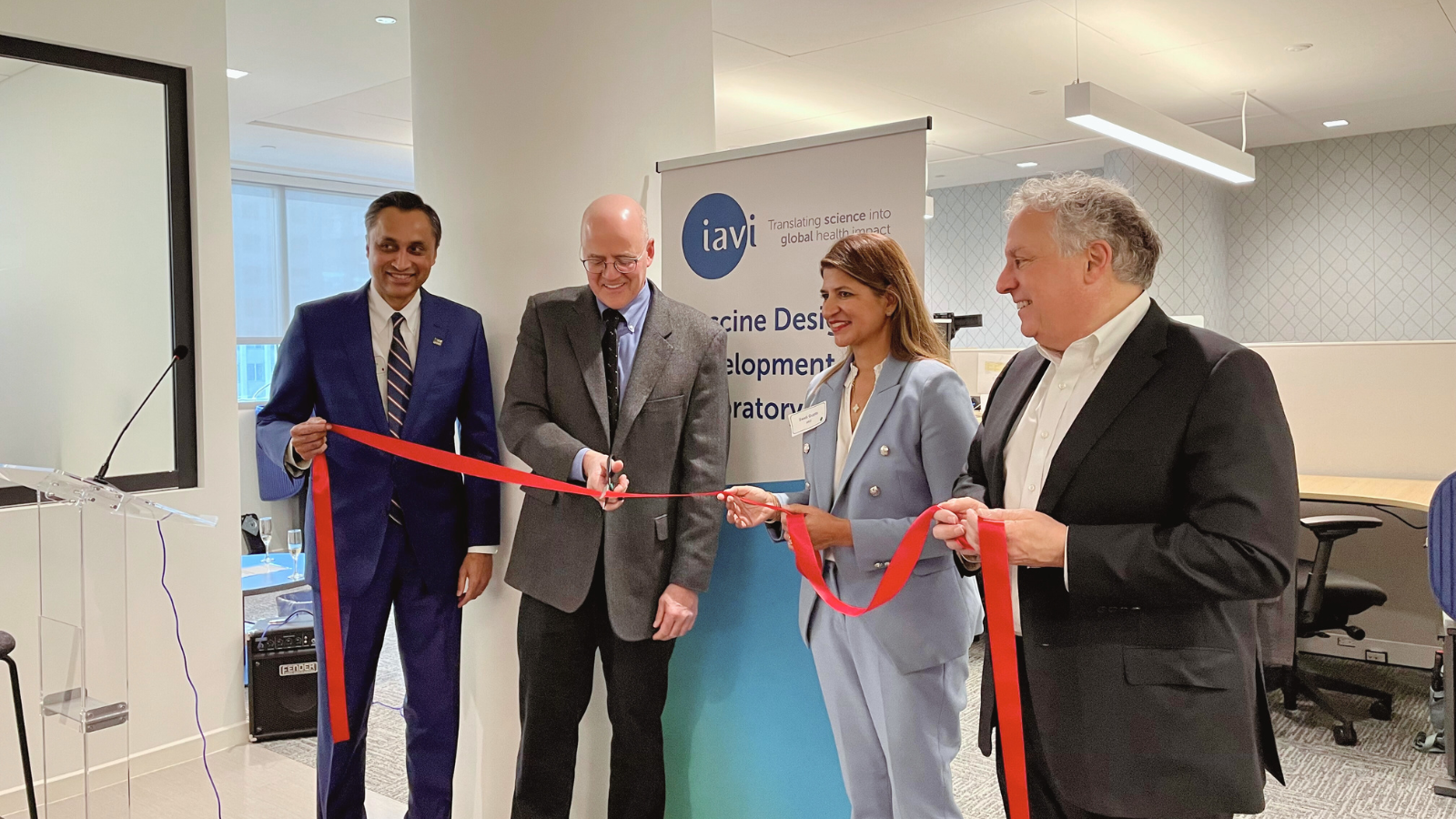 IAVI Vaccine Design and Development Lab (DDL) opening ribbon cutting. Pictured left to right: John Coelho, senior advisor, life sciences strategic innovation centers at the New Jersey Economic Development Authority; Christopher Parks, Ph.D., associate vice president of viral vaccines and head of the IAVI DDL; Swati Gupta, DrPH, MPH, vice president and head of emerging infectious diseases and epidemiology at IAVI; and Mark Feinberg, M.D., Ph.D., IAVI president and CEO.