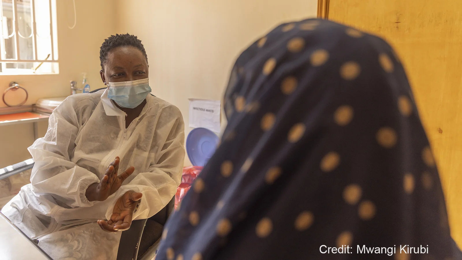 Angela Nansere with a patient at Masaka Laboratory in July 2022. Credit: Mwangi Kirubi